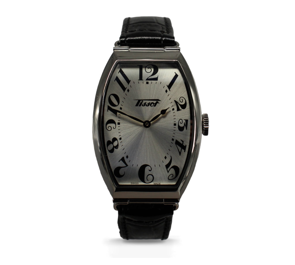  De Tissot Heritage Porto T128.509.16.032.00 is een stijlvol herenhorloge met roestvrijstalen kast, zwarte lederen band en betrouwbaar quartz uurwerk. Verkrijgbaar bij Optiwatch